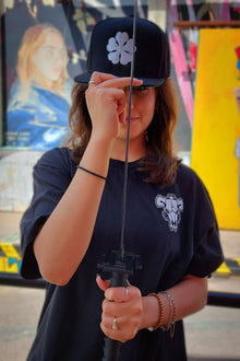 Model wearing Five Clover anime cap - Nakama Clothing