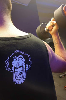 Model wearing The Strongest Human anime tank top - Nakama Clothing