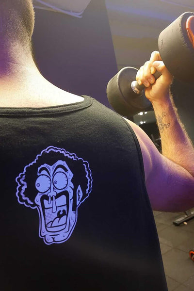 Model wearing The Strongest Human anime tank top - Nakama Clothing